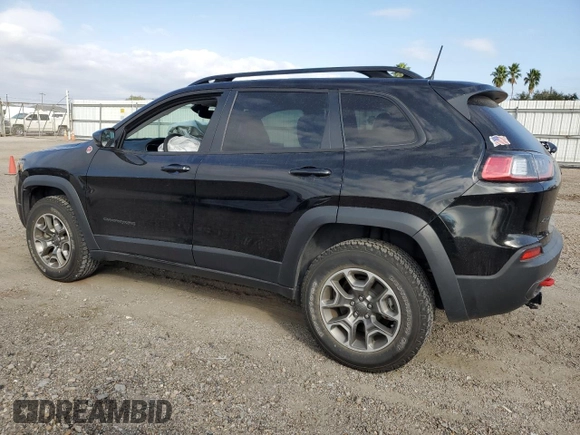 2022 Jeep Cherokee Trailhawk with VIN 1C4PJMBX8ND554044, listed as a Copart auction lot 82687464 with 13,353 mi miles and Salvage Title. Bid and sale history available at carsss.com. Image 2.