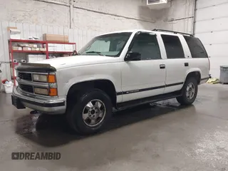 1999 Chevrolet Tahoe Z71 z VIN 1GNEK13R0XJ364222, wystawiony jako IAAI lot #41988710 z przebiegiem 204 577 mil mil oraz . Historia ofert i sprzedaży dostępna na DreamBid. Obrazek 2.