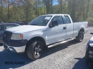 2007 Ford F-150 STX with VIN 1FTRX14W87FA14579, listed as a IAAI auction lot 40503694 with 164,718 mi miles. Bid and sale history available at carsss.com. Image 2.