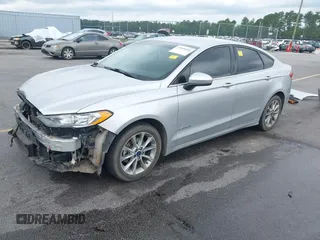 2017 Ford Fusion Hybrid SE with VIN 3FA6P0LU2HR317784, listed as a IAAI auction lot 42618554 with 114,814 mi miles and . Bid and sale history available at DreamBid. Image 2.