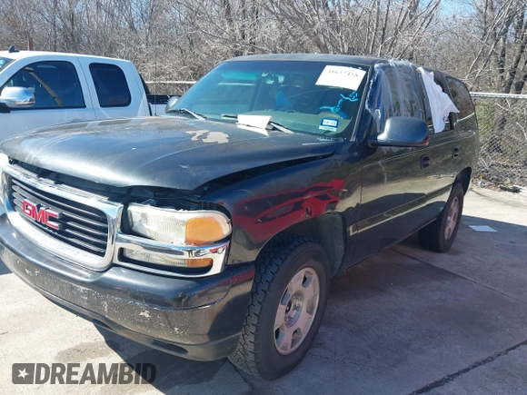 2003 GMC Yukon SLT with VIN 1GKEC13V23R135379, listed as a IAAI auction lot 41637458 with 236,134 mi miles. Bid and sale history available at carsss.com. Image 2.