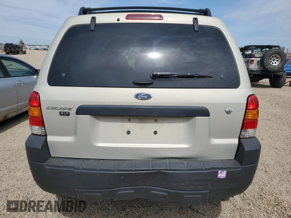 2005 Ford Escape XLT with VIN 1FMYU03165KC03784, listed as a Copart auction lot 64299225 with 185,033 mi miles and Salvage title. Bid and sale history available at DreamBid. Image 6.