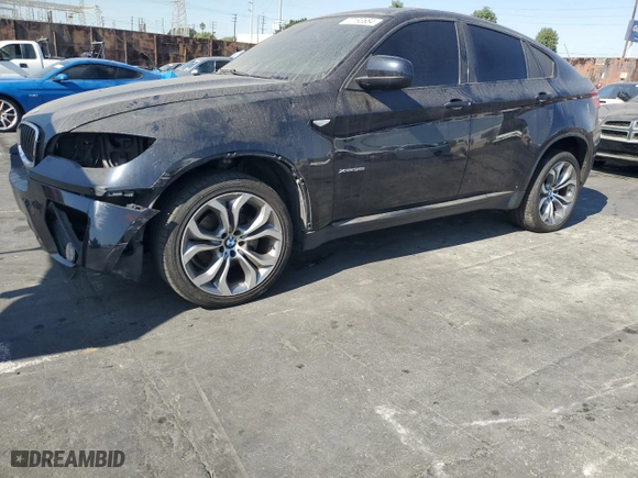 2014 BMW X6 xDrive35i with VIN 5UXFG2C53E0C43500, listed as a Copart auction lot 77193684 with 124,454 mi miles and Clean Title. Bid and sale history available at carsss.com. Image 1.