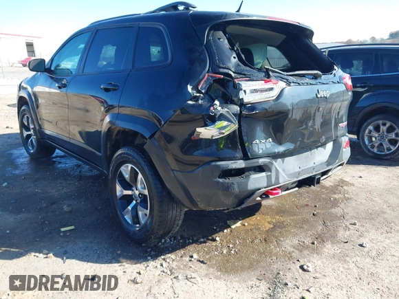 2015 Jeep Cherokee Trailhawk with VIN 1C4PJMBSXFW687737, listed as a IAAI auction lot 40963392 with 119,805 mi miles. Bid and sale history available at carsss.com. Image 3.