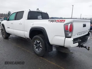 2021 Toyota Tacoma SR5 with VIN 3TMDZ5BN1MM100575, listed as a IAAI auction lot 41516274 with 61,974 mi miles and . Bid and sale history available at DreamBid. Image 3.