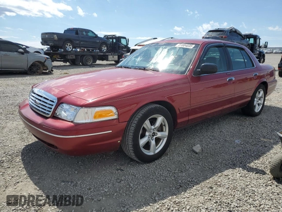 2003 Ford Crown Victoria LX z VIN 2FAFP74W43X100336, wystawiony jako Copart lot #51004035 z przebiegiem 82 089 mil mil oraz Szkoda całkowita • Salvage title. Historia ofert i sprzedaży dostępna na DreamBid. Obrazek 1.