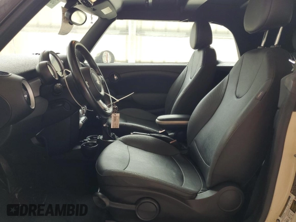 2010 MINI Convertible with VIN WMWMR3C59ATU98597, listed as a Copart auction lot 53336025 with 88,273 mi miles and Salvage Title. Bid and sale history available at DreamBid. Image 7.