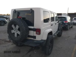 2010 Jeep Wrangler Unlimited Sahara with VIN 1J4BA5H15AL184376, listed as a IAAI auction lot 41270637 with 143,339 mi miles. Bid and sale history available at carsss.com. Image 4.