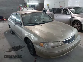 1999 Mazda 626 ES with VIN 1YVGF22C9X5823002, listed as a IAAI auction lot 41385617 with 149,127 mi miles. Bid and sale history available at carsss.com. Image 1.