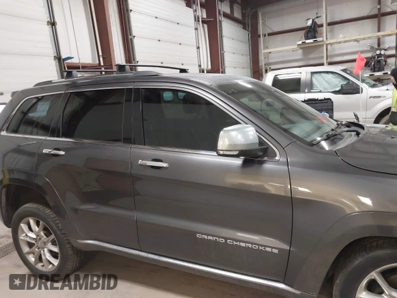 2015 Jeep Grand Cherokee Summit with VIN 1C4RJFJT6FC754799, listed as a IAAI auction lot 41699124 with 124,206 mi miles and . Bid and sale history available at DreamBid. Image 13.