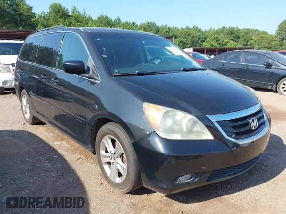 2010 Honda Odyssey Touring with VIN 5FNRL3H97AB104359, listed as a IAAI auction lot 42555872 with 233,952 mi miles and . Bid and sale history available at DreamBid. Image 1.