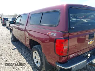 2015 Chevrolet Silverado 1500 LT with VIN 3GCUKREC0FG428366, listed as a IAAI auction lot 42210969 with 118,352 mi miles and . Bid and sale history available at DreamBid. Image 3.