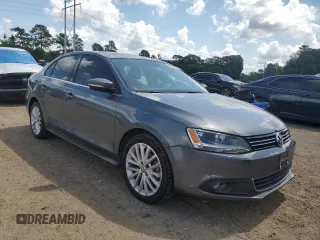 2014 Volkswagen Jetta TDI w/Premium with VIN 3VWLL7AJ4EM374570, listed as a Copart auction lot 63996195 with 186,497 mi miles and Salvage title. Bid and sale history available at DreamBid. Image 4.