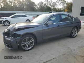 2018 BMW 3 Series with VIN WBA8F1C57JK898467, listed as a Copart auction lot 82301334 with 70,666 mi miles and Salvage title. Bid and sale history available at DreamBid. Image 1.