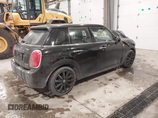 2017 MINI Hardtop 4 Door Cooper with VIN WMWXU1C34H2F78228, listed as a IAAI auction lot 41549060 with 49,393 mi miles. Bid and sale history available at carsss.com. Image 4.