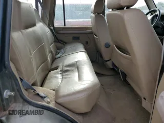 1997 Land Rover Discovery SD with VIN SALJY1249VA705067, listed as a Copart auction lot 77047054 with 146,965 mi miles and Clean Title. Bid and sale history available at carsss.com. Image 10.
