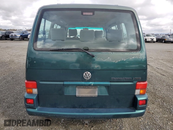 1999 Volkswagen EuroVan с VIN WV2MH8708XH001005, выставлен на аукционе Copart как лот 48987245 с пробегом 210 081 миль миль и Чистый • Clean title. История ставок и продаж доступна на DreamBid. Изображение 6.