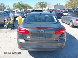 2018 Ford Focus SE z VIN 1FADP3F27JL245603, wystawiony jako IAAI lot #41773395 z przebiegiem 94 044 mil mil oraz . Historia ofert i sprzedaży dostępna na DreamBid. Obrazek 16.