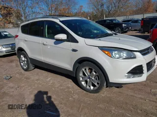 2016 Ford Escape Titanium with VIN 1FMCU9JX0GUC43310, listed as a IAAI auction lot 41857149 with 75,441 mi miles and . Bid and sale history available at DreamBid. Image 1.