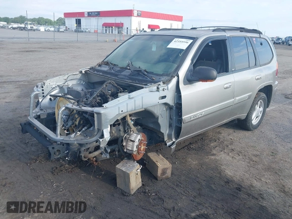 2002 GMC Envoy SLE z VIN 1GKDS13S122357410, wystawiony jako IAAI lot #42355556 z przebiegiem Nie podano mil oraz . Historia ofert i sprzedaży dostępna na DreamBid. Obrazek 2.