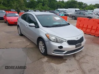 2014 Kia Forte LX with VIN KNAFX4A63E5099825, listed as a IAAI auction lot 42119316 with 174,551 mi miles and . Bid and sale history available at carsss.com. Image 1.
