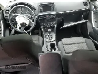 2014 Mazda CX-5 Touring z VIN JM3KE4CYXE0426408, wystawiony jako Copart lot #57355115 z przebiegiem Nie podano mil oraz Szkody całkowita. Historia ofert i sprzedaży dostępna na DreamBid. Obrazek 8.