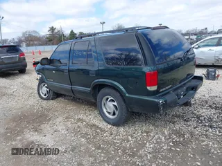 2003 Chevrolet Blazer LS z VIN 1GNDT13X93K177170, wystawiony jako IAAI lot #41839837 z przebiegiem 148 555 mil mil oraz . Historia ofert i sprzedaży dostępna na DreamBid. Obrazek 3.