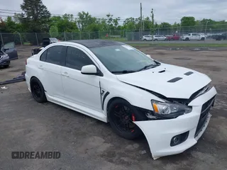 2013 Mitsubishi Lancer Evolution GSR z VIN JA32W8FV0DU023509, wystawiony jako IAAI lot #42222552 z przebiegiem 128 030 mil mil oraz . Historia ofert i sprzedaży dostępna na DreamBid. Obrazek 1.