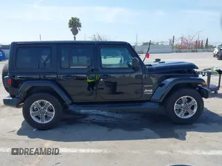 2020 Jeep Wrangler Unlimited Sahara with VIN 1C4HJXEN6LW235159, listed as a IAAI auction lot 42045083 with 68,400 mi miles and . Bid and sale history available at DreamBid. Image 13.