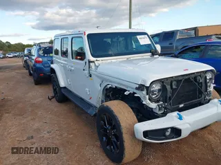 2021 Jeep Wrangler Unlimited Sahara with VIN 1C4JJXP64MW840094, listed as a IAAI auction lot 40830676 with 31,716 mi miles and . Bid and sale history available at DreamBid. Image 1.