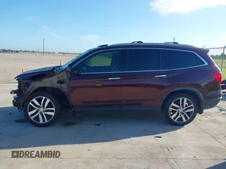 2017 Honda Pilot Touring with VIN 5FNYF5H96HB038413, listed as a IAAI auction lot 42594065 with 130,501 mi miles and . Bid and sale history available at DreamBid. Image 14.