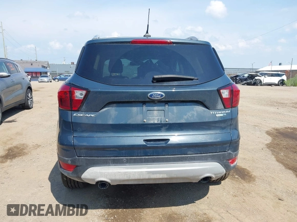 2019 Ford Escape Titanium with VIN 1FMCU9J99KUC00935, listed as a IAAI auction lot 42583250 with 91,241 mi miles and . Bid and sale history available at DreamBid. Image 17.