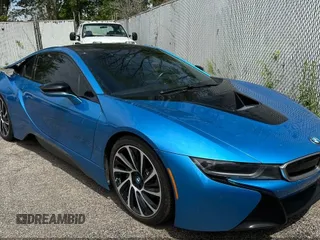 2014 BMW i8 z VIN WBY2Z2C57EVX64471, wystawiony jako IAAI lot #42244494 z przebiegiem 102 064 mil mil oraz . Historia ofert i sprzedaży dostępna na DreamBid. Obrazek 1.