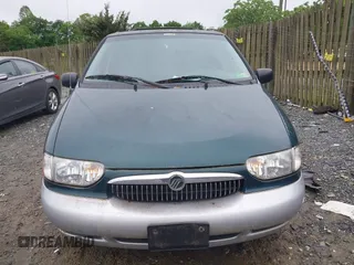 2000 Mercury Villager z VIN 4M2XV11T3YDJ28665, wystawiony jako IAAI lot #42251462 z przebiegiem 113 809 mil mil oraz . Historia ofert i sprzedaży dostępna na DreamBid. Obrazek 6.