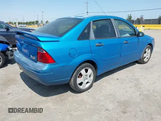 2007 Ford Focus S z VIN 1FAHP34N77W333895, wystawiony jako IAAI lot #42444411 z przebiegiem 155 522 mil mil oraz . Historia ofert i sprzedaży dostępna na DreamBid. Obrazek 4.