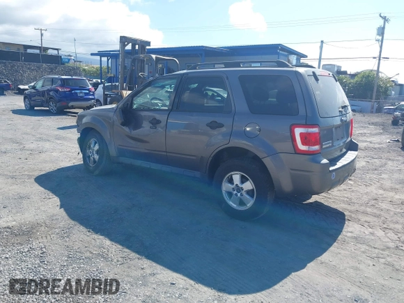 2011 Ford Escape XLT with VIN 1FMCU0D79BKB79697, listed as a IAAI auction lot 41265677 with 138,026 mi miles. Bid and sale history available at carsss.com. Image 3.