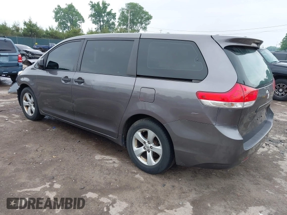 2014 Toyota Sienna L with VIN 5TDZK3DC5ES439593, listed as a IAAI auction lot 42420219 with 136,544 mi miles and . Bid and sale history available at DreamBid. Image 3.