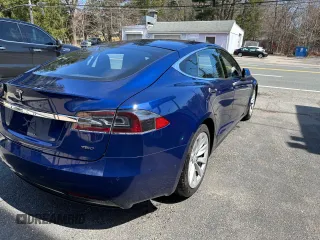 2016 Tesla Model S 90D with VIN 5YJSA1E29GF153669, listed as a Copart auction lot 63765555 with 87,476 mi miles and Clean title. Bid and sale history available at DreamBid. Image 4.