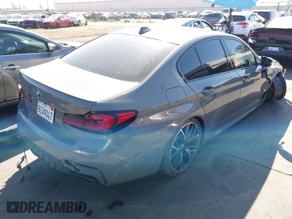 2022 BMW 5 Series M550i xDrive with VIN WBA13BK02NCJ61943, listed as a IAAI auction lot 41607980 with Not provided miles and . Bid and sale history available at DreamBid. Image 4.
