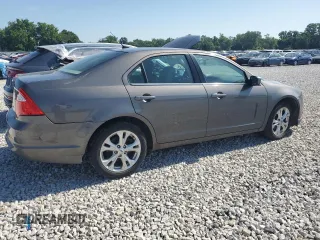 2012 Ford Fusion SE with VIN 3FAHP0HA1CR235996, listed as a Copart auction lot 61243025 with 165,218 mi miles and Salvage title. Bid and sale history available at DreamBid. Image 3.