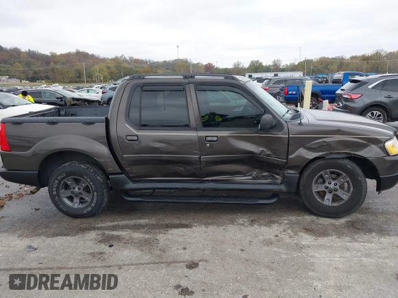 2005 Ford Explorer Sport Trac XLS z VIN 1FMZU77K05UB13891, wystawiony jako IAAI lot #40859877 z przebiegiem 157 308 mil mil oraz . Historia ofert i sprzedaży dostępna na DreamBid. Obrazek 13.