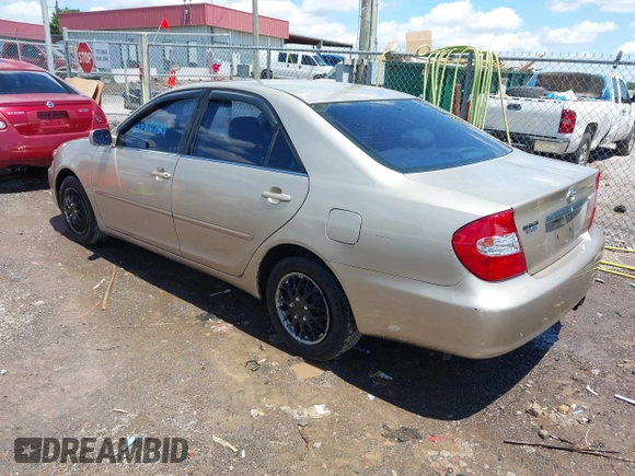 2002 Toyota Camry LE z VIN 4T1BE32K42U592181, wystawiony jako IAAI lot #42206721 z przebiegiem 299 947 mil mil oraz . Historia ofert i sprzedaży dostępna na DreamBid. Obrazek 3.