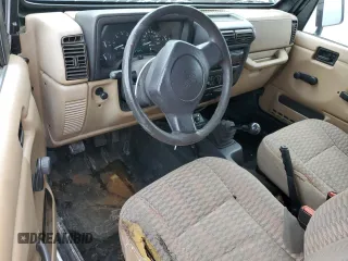 2000 Jeep Wrangler Sport with VIN 1J4FA49S9YP743515, listed as a Copart auction lot 53906305 with 247,349 mi miles and Salvage title. Bid and sale history available at DreamBid. Image 8.