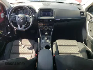 2014 Mazda CX-5 Touring with VIN JM3KE2CY9E0356050, listed as a Copart auction lot 65470674 with 70,400 mi miles and Salvage Title. Bid and sale history available at DreamBid. Image 8.
