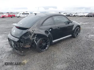 2014 Volkswagen Beetle 2.5L w/Sun with VIN 3VWJP7AT3EM608906, listed as a IAAI auction lot 41501830 with 42,804 mi miles and . Bid and sale history available at DreamBid. Image 4.