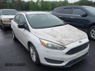 2016 Ford Focus SE z VIN 1FADP3F20GL298068, wystawiony jako IAAI lot #42336086 z przebiegiem 143 646 mil mil oraz . Historia ofert i sprzedaży dostępna na DreamBid. Obrazek 1.