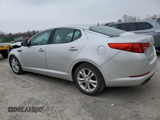 2013 Kia Optima EX z VIN 5XXGN4A7XDG144632, wystawiony jako Copart lot #83599614 z przebiegiem 97 316 mil mil oraz Szkoda całkowita • Salvage title. Historia ofert i sprzedaży dostępna na DreamBid. Obrazek 2.
