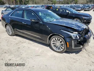 2014 Cadillac CTS Luxury AWD with VIN 1G6AX5S30E0130276, listed as a Copart auction lot 53934825 with 12,850 mi miles and Clean Title. Bid and sale history available at DreamBid. Image 4.