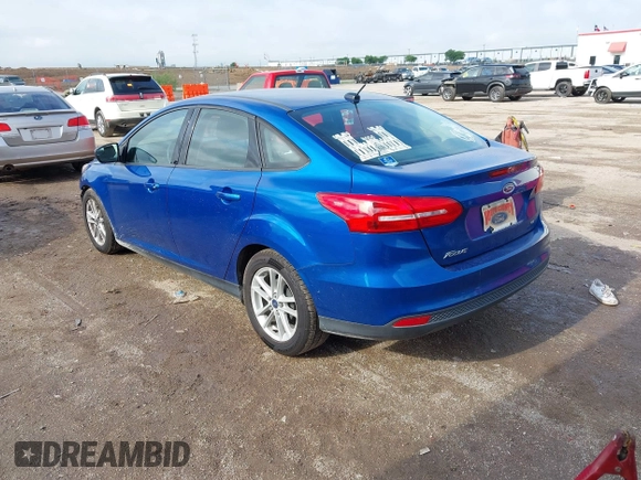 2018 Ford Focus SE z VIN 1FADP3F2XJL293337, wystawiony jako IAAI lot #42121294 z przebiegiem 71 241 mil mil oraz . Historia ofert i sprzedaży dostępna na DreamBid. Obrazek 3.
