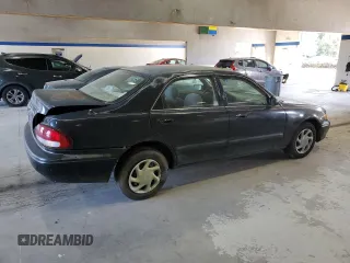 1998 Mazda 626 DX with VIN 1YVGF22C2W5751008, listed as a Copart auction lot 74742174 with 172,980 mi miles and Salvage Title. Bid and sale history available at carsss.com. Image 3.